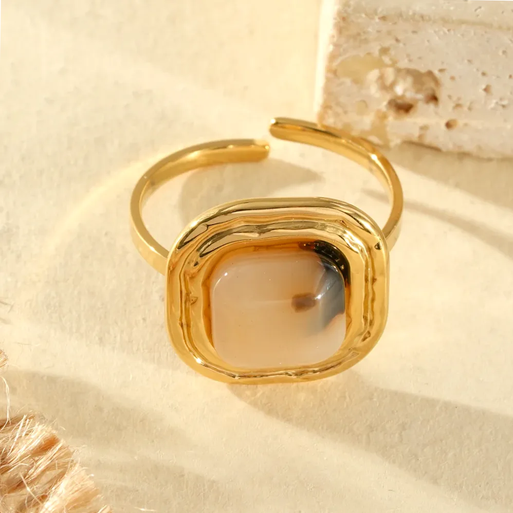 Close-up of material and finish — gold adjustable ring square leopard resin