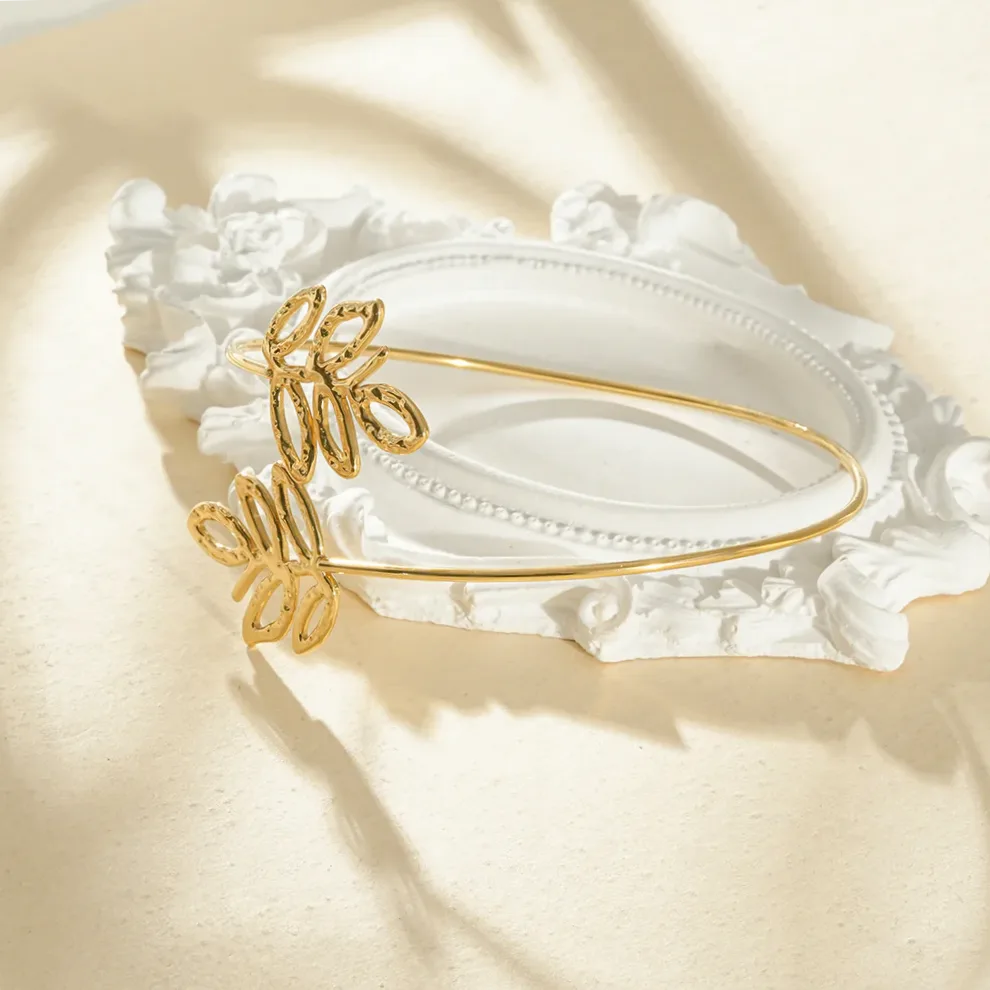 Open arm cuff bracelet hammered double leaf worn on the wrist