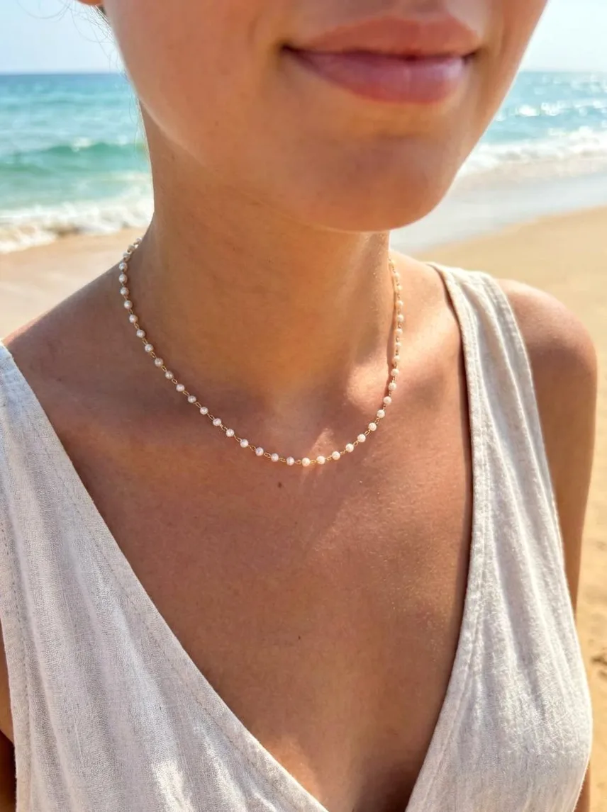 Close-up of material and finish — Y back necklace gold chain with small pearls