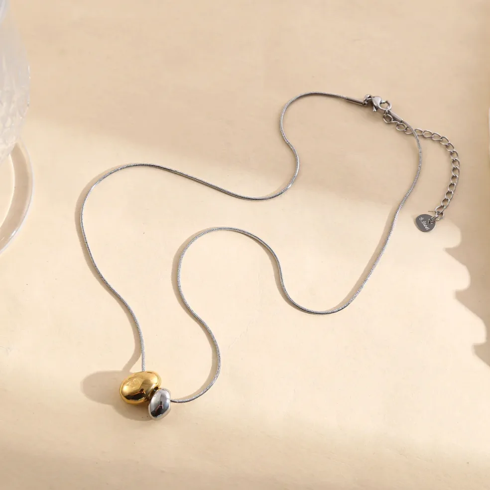 Collier chaîne argentée serpent pendentif bombé doré et argenté