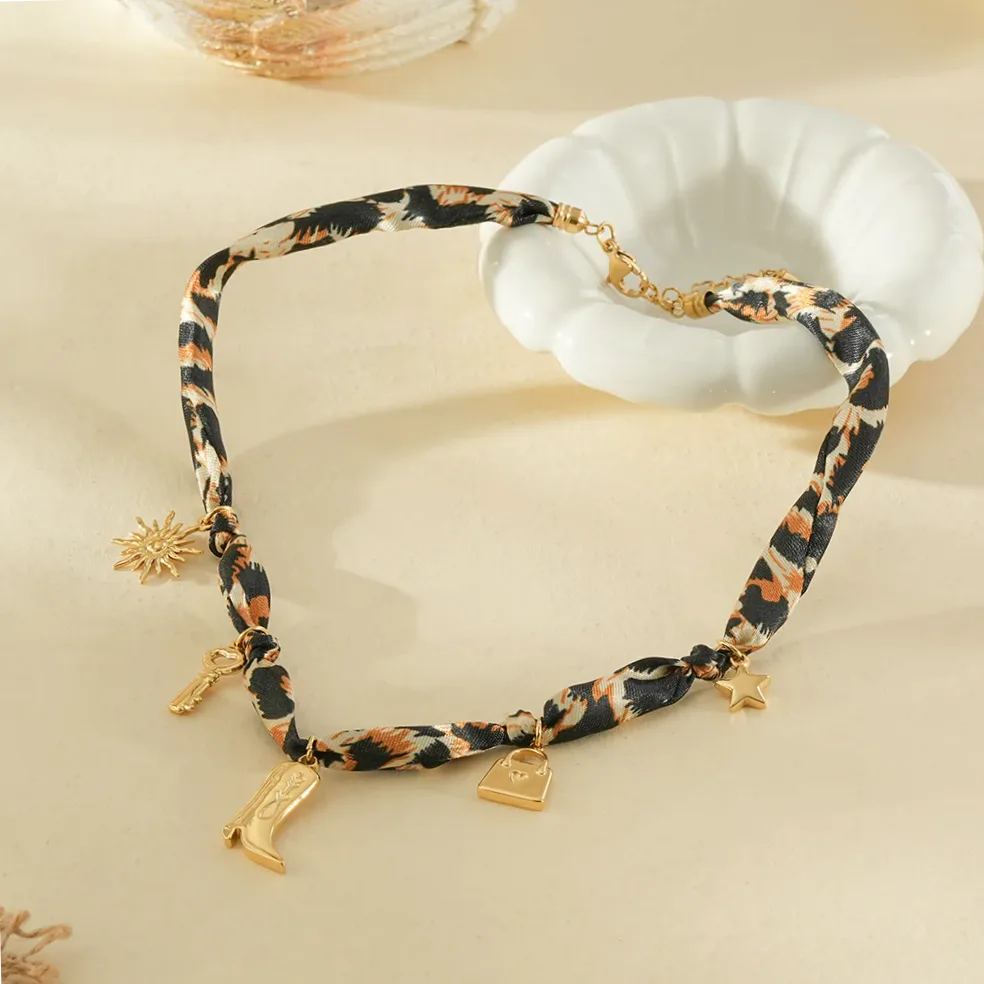 Leopard print fabric necklace gold boot pendants worn around the neck