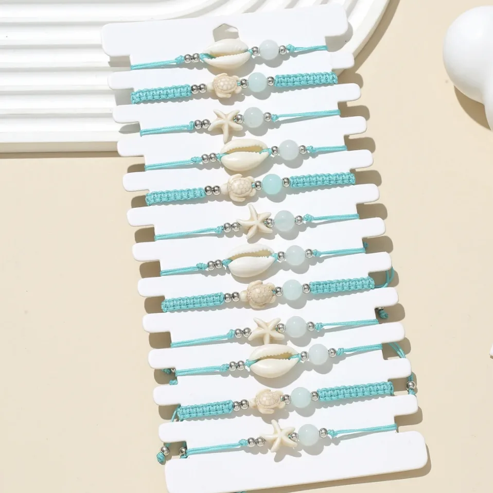 Set mit geflochtenen Armbändern in Türkis mit maritimem Motiv